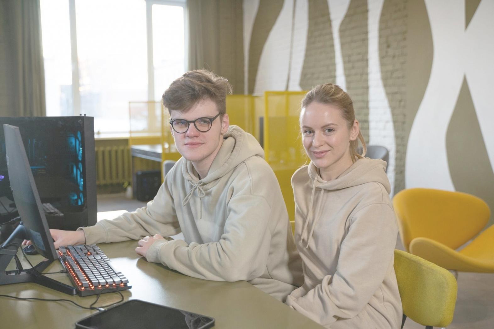 Students collaborating on testing projects in modern learning environment